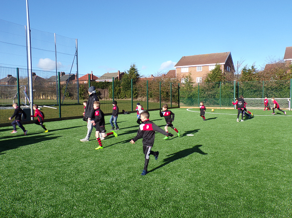 grassroots football club playing on 3g pitch
