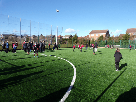 children playing on 3G outdoor football pitch