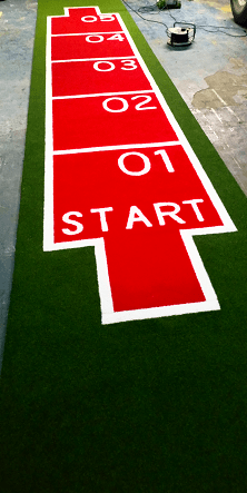 artificial grass sled track in red and green