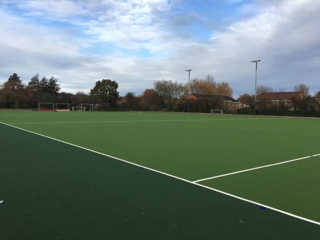 green hockey pitch with dark border