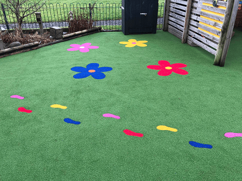 flowers and footprints in artificial turf playground