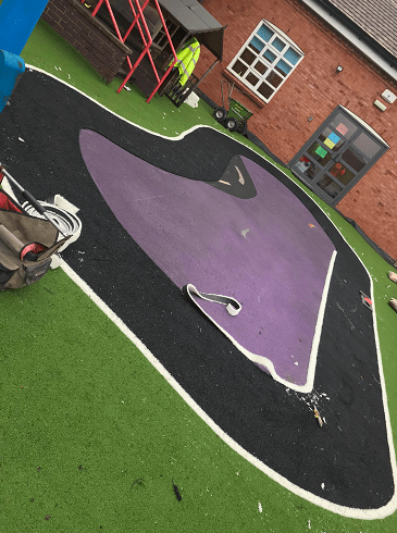 cutting astro turf on playground