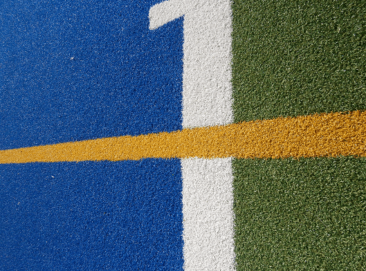 close up view of blue white and green artificial turf