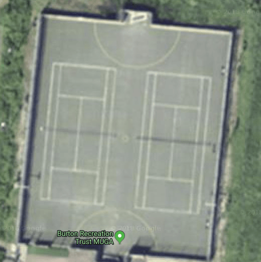 overhead image of old and worn tennis courts on a muga