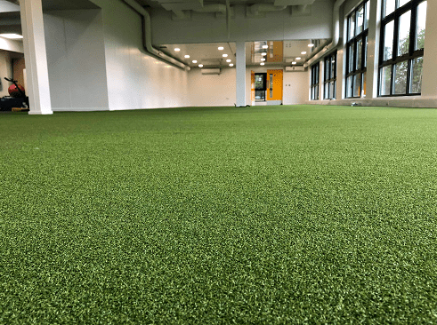 football gym flooring with green artificial grass