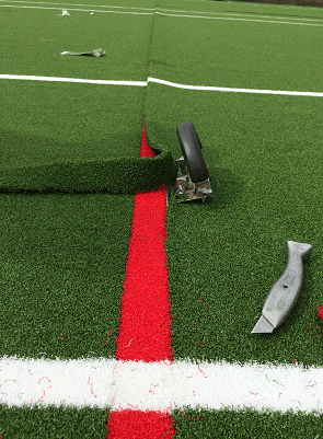 cutting in artificial turf line markings