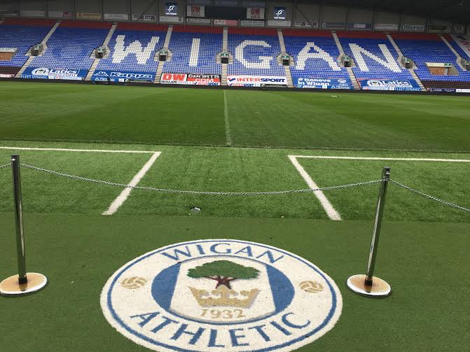 wigan athletic logo mat on the artificial turf green touchlines