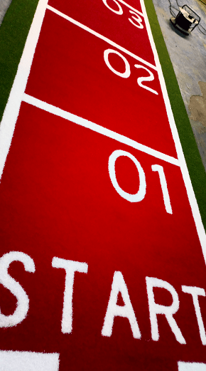 green, red and white gym mat with numbers