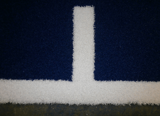 close up view of artificial turf in blue and white