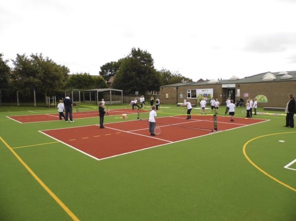 Oakridge Primary School MUGA with pupils playing tennis on it