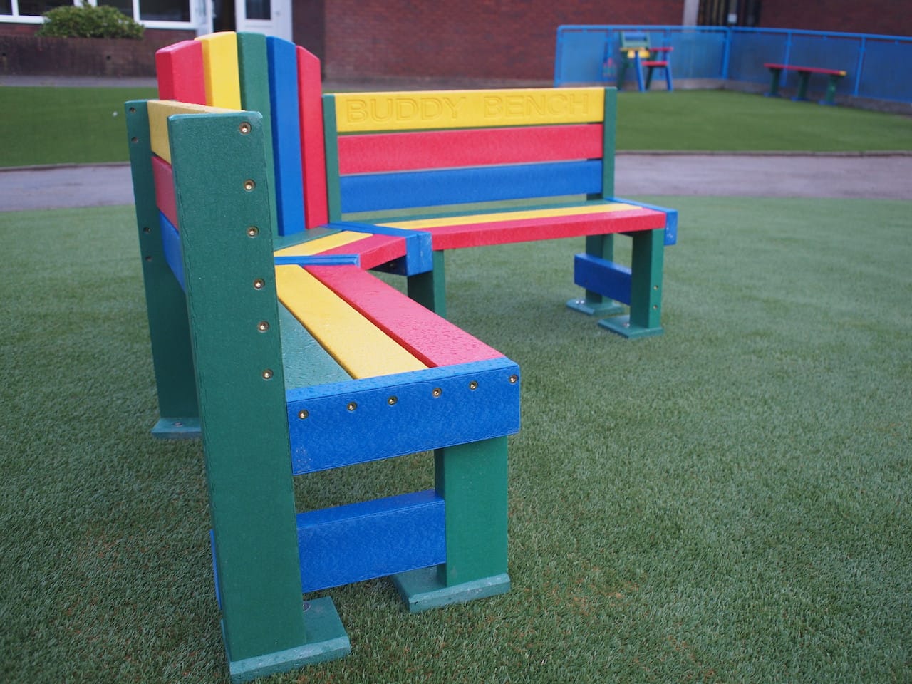 STM artificial grass and Marmax buddy bench playground equipment