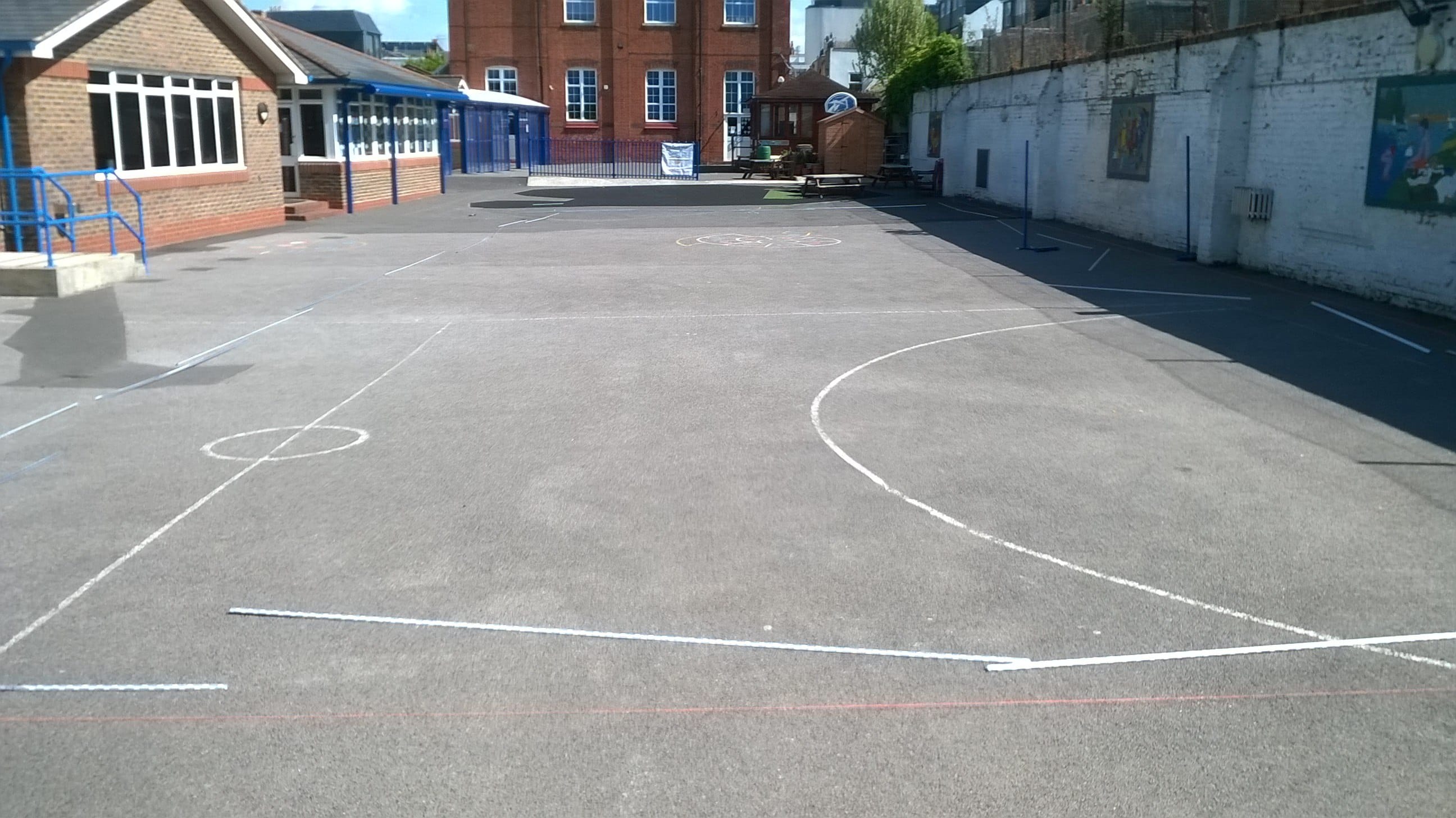 Tarmac Playground before installation of artificial grass playground surface by stm