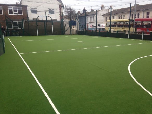 Brighton College’s green netball pitch with white line markings