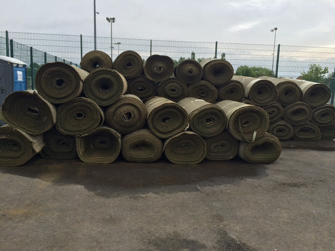 rolls of turf ready for turf disposal
