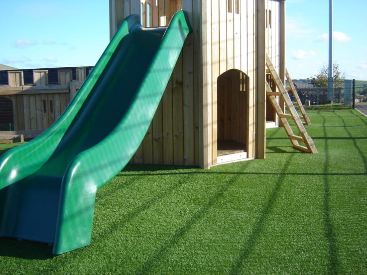wooden playground climbing frame with slide
