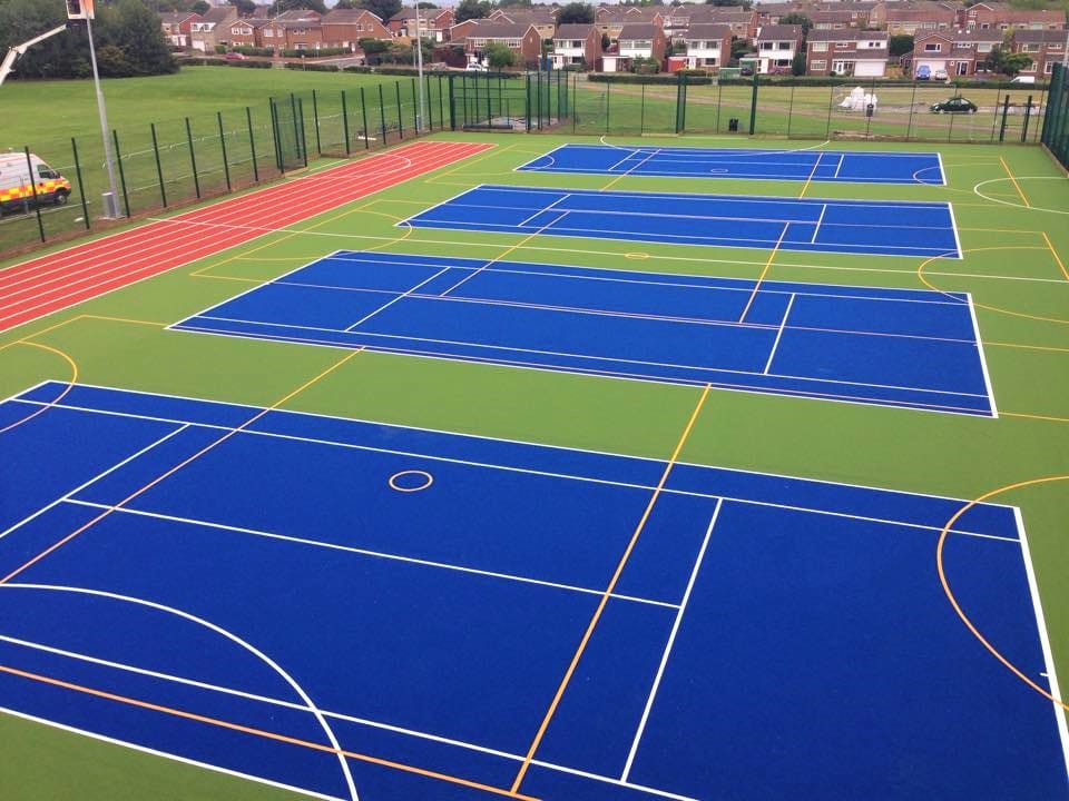 drone view of large scale muga in green and blue
