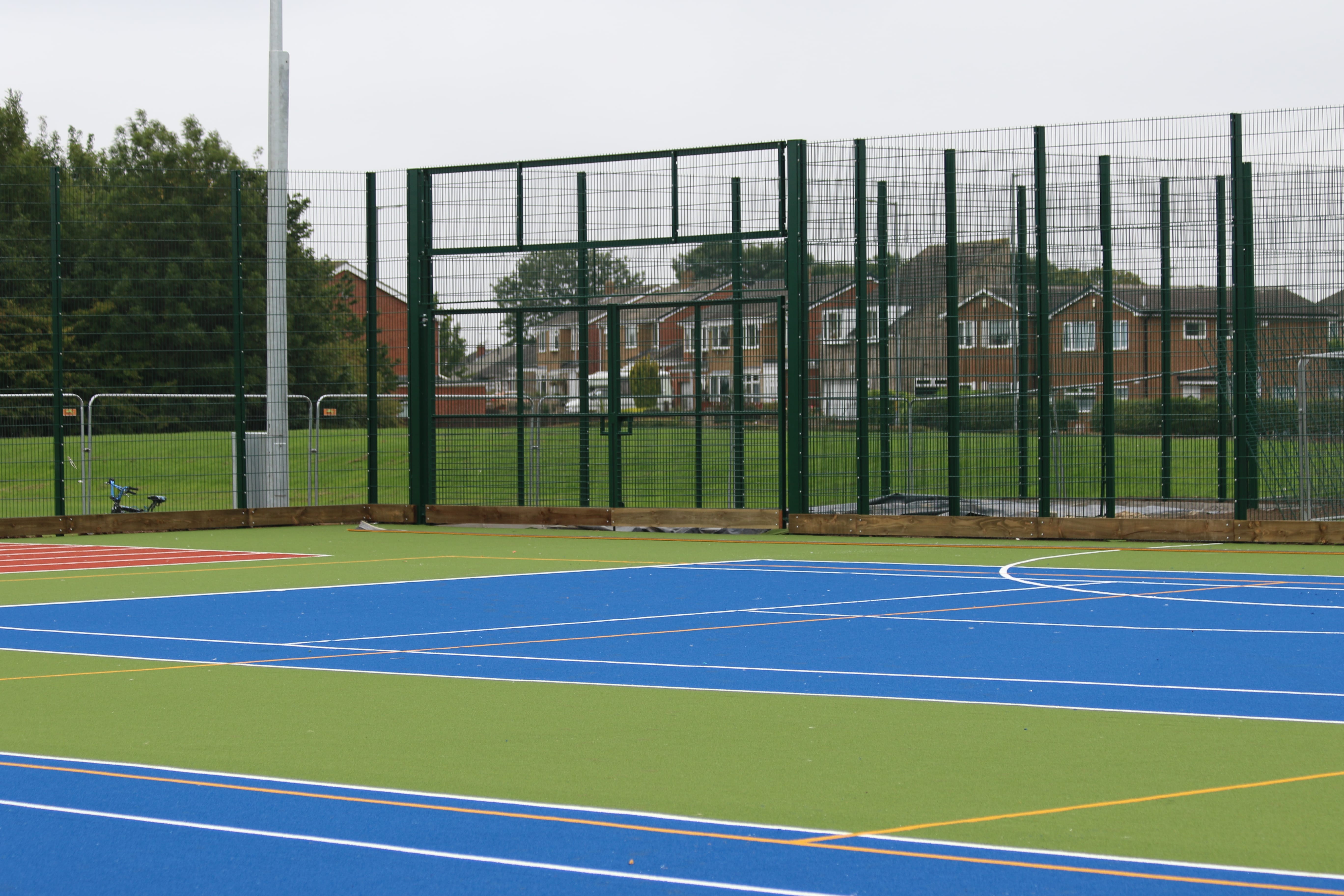 new metal fencing and floodlights