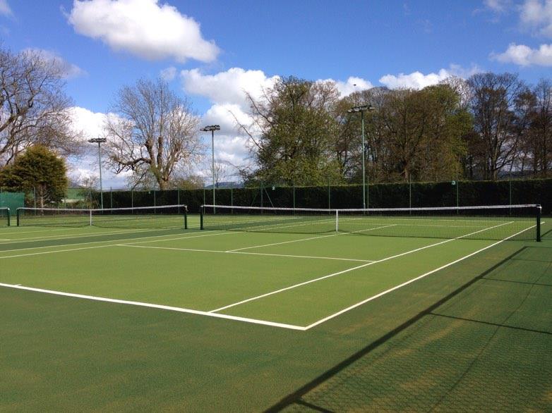 Whole tennis court in the sunshine