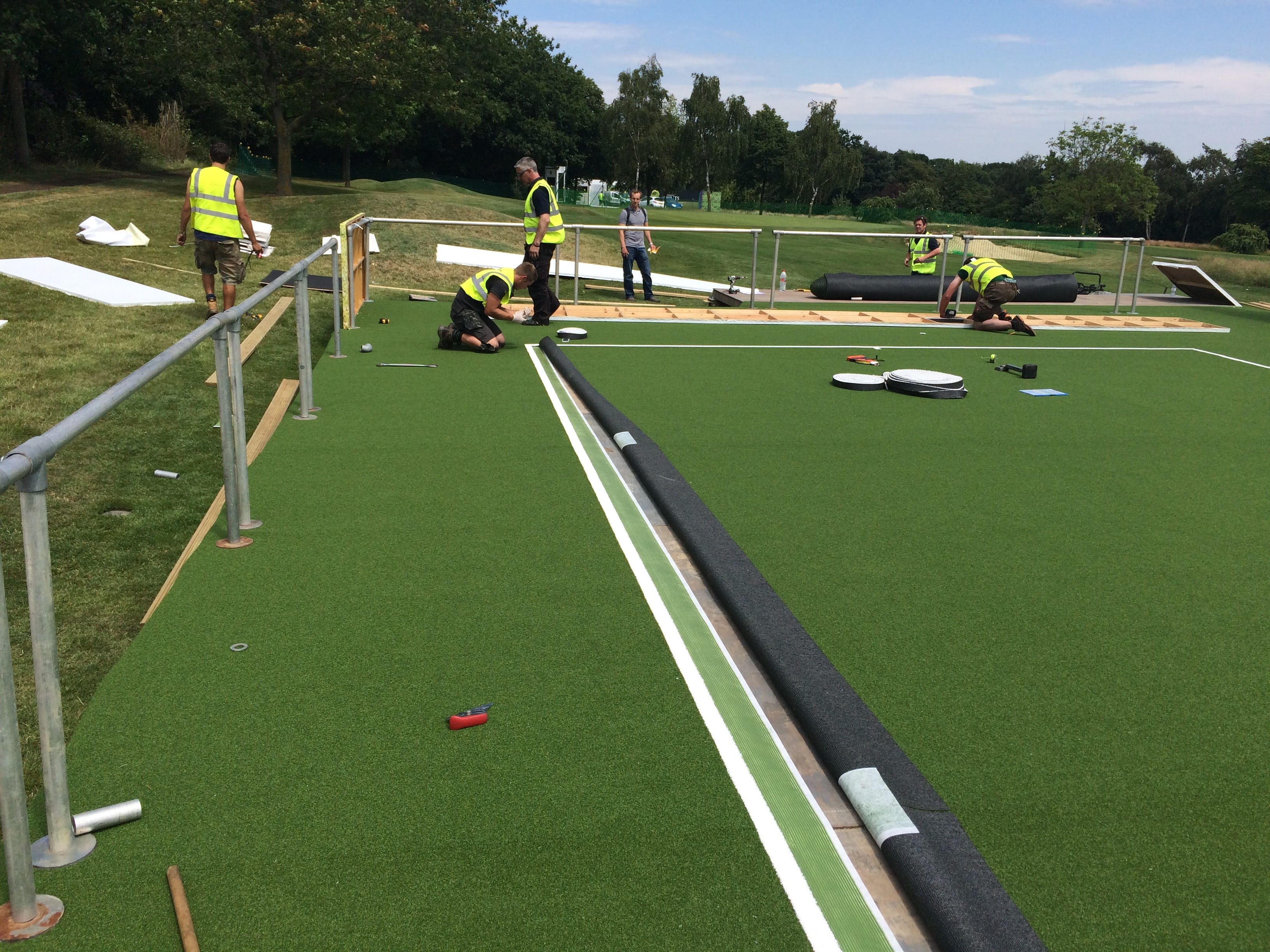 installing tennis court at WImbledon