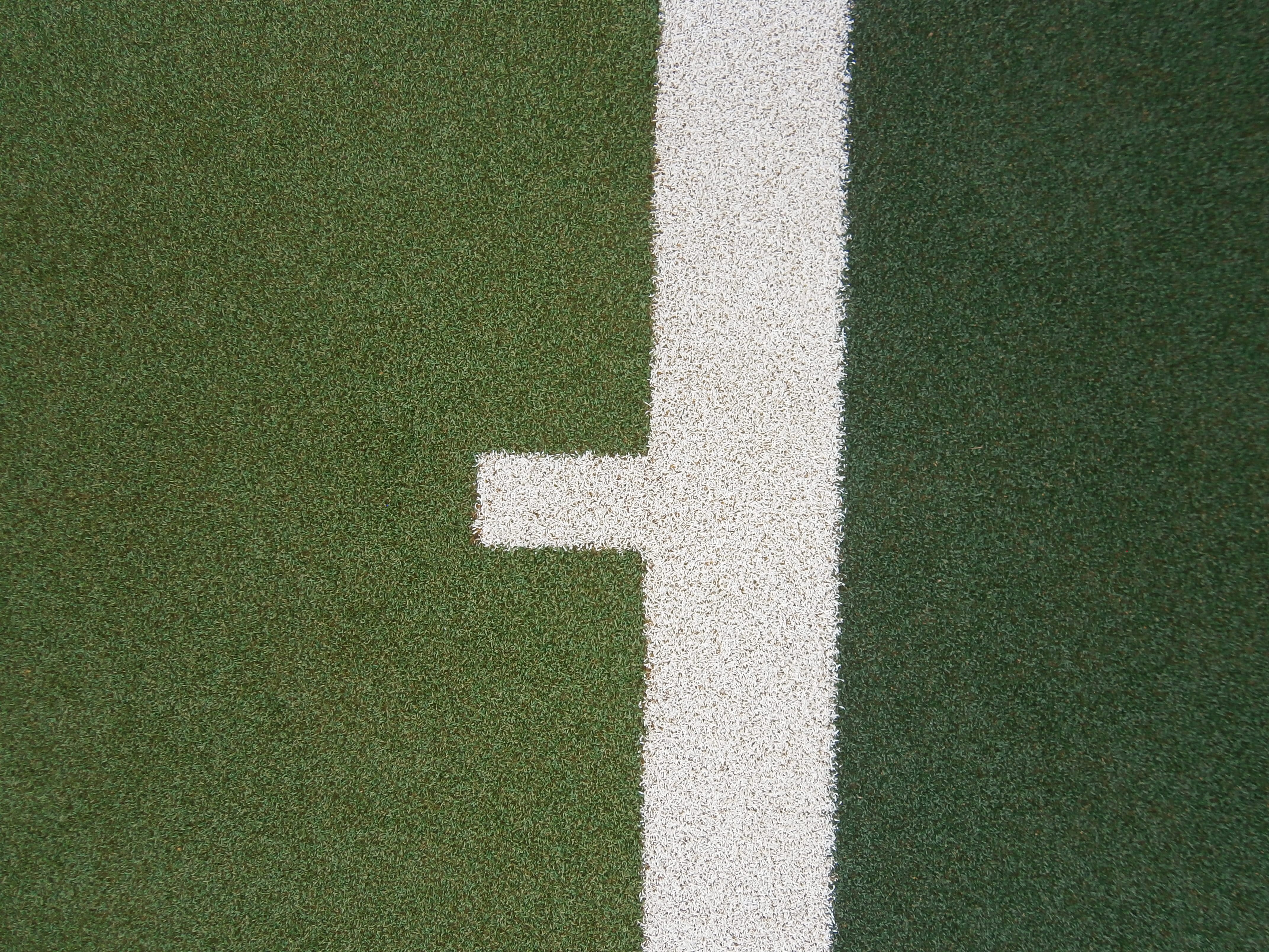 close up view of white line markings on tennis court