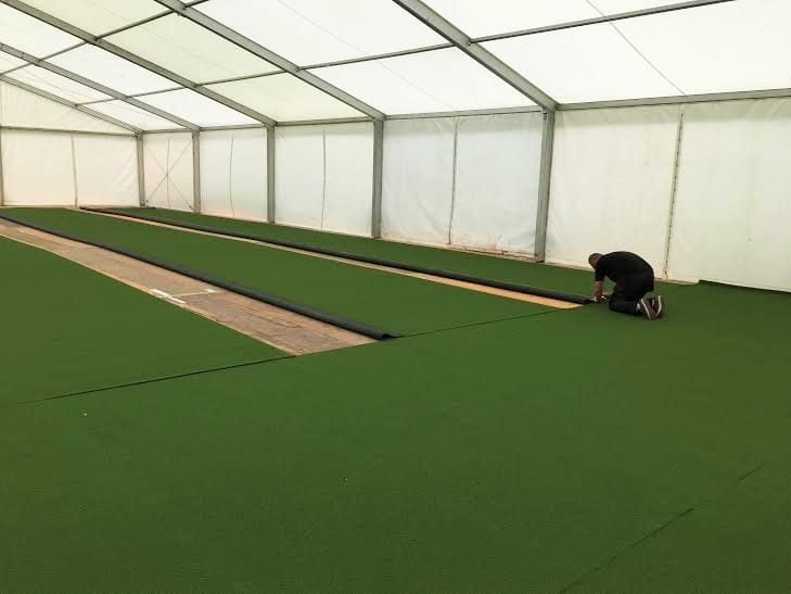 installing an indoor tennis court in a marquee