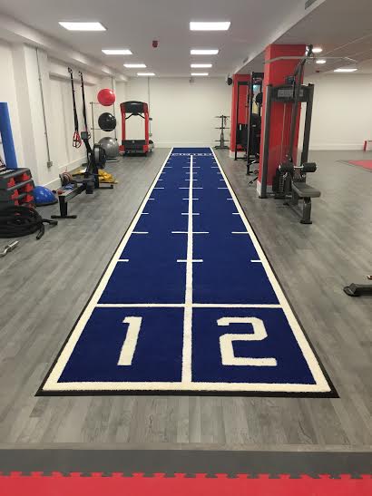finished result showing two lane gym track installed at the gym