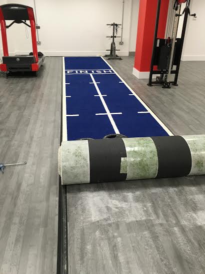 rolling out the new sled track at the gym