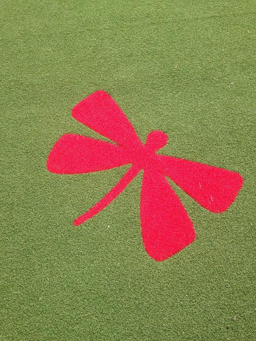 red dragonfly design on synthetic turf