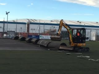 removing the old astroturf pitch 