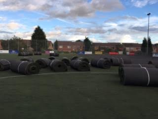 the whole pitch uplift showing rolls of astroturf on pitch