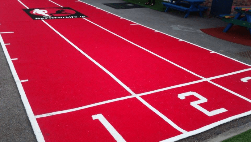 three lane red gym track with gym logo and numbers