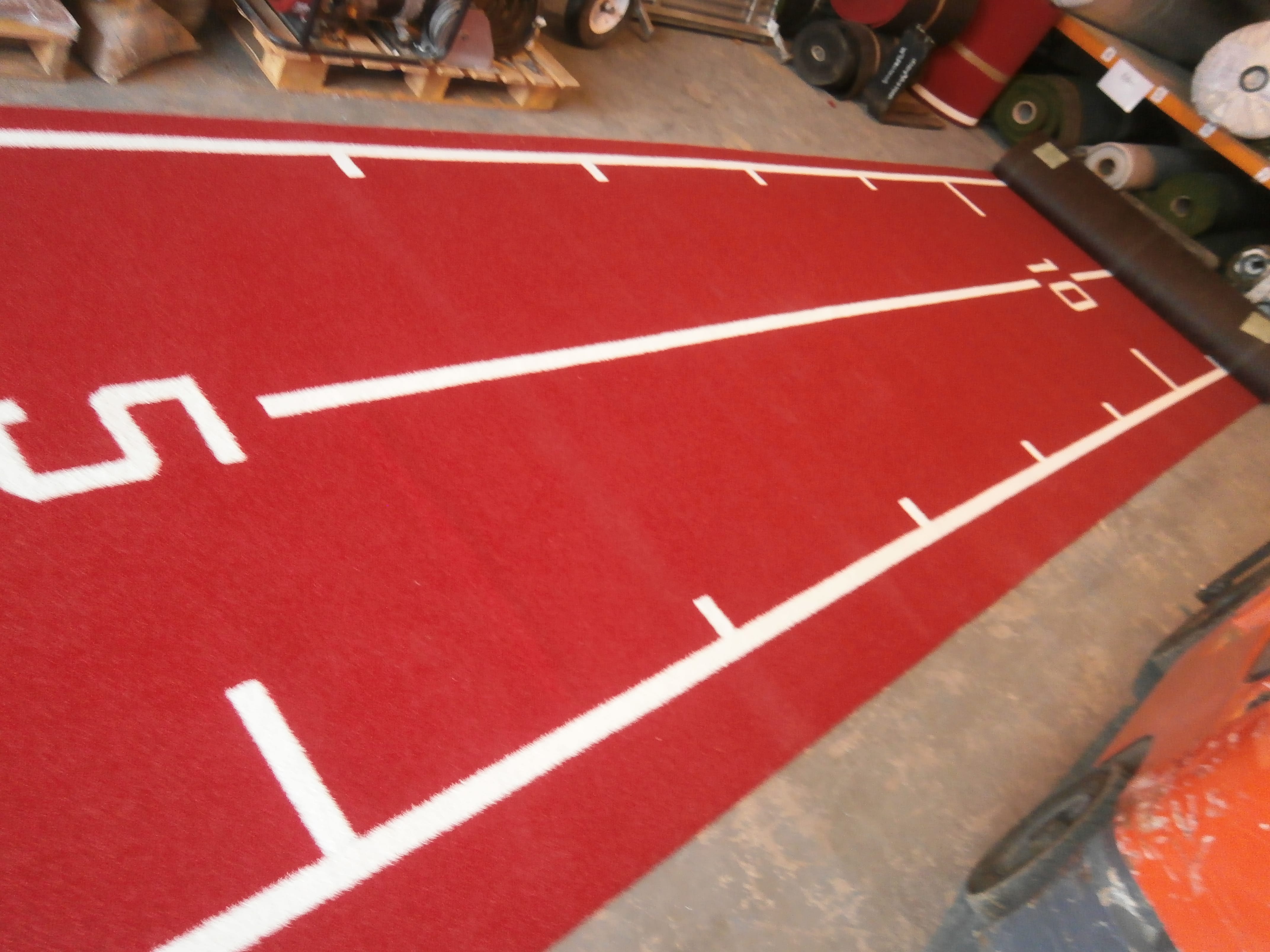 red bespoke artificial turf gym track