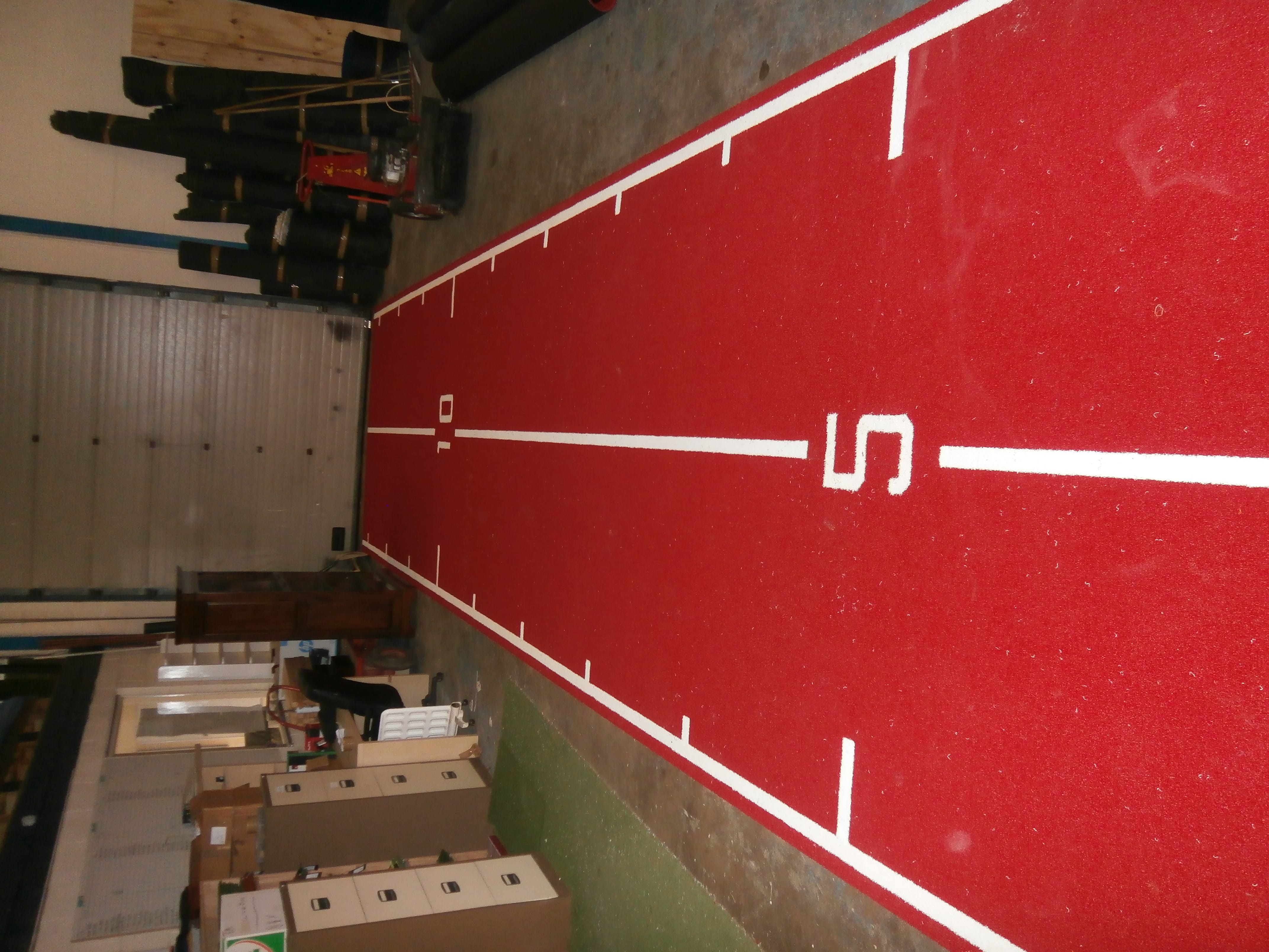 gym turf mat markings in white on red gym track