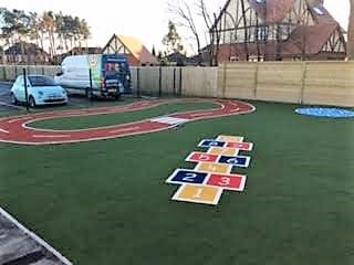 roadway and hopscotch as part of synthetic turf playground