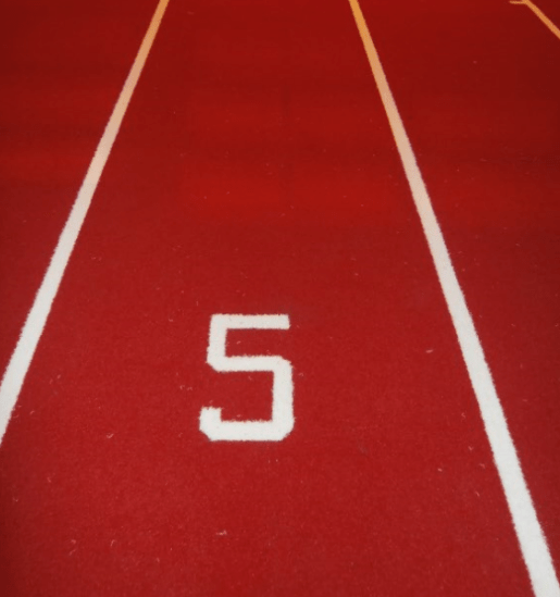 number 5 cut into gym track