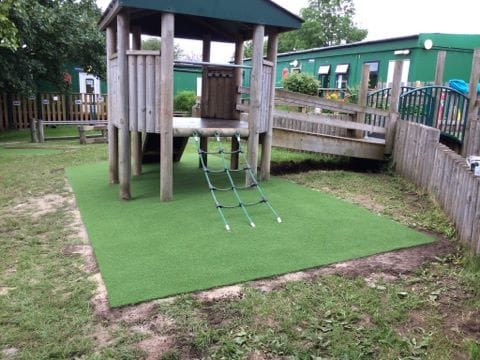 artificial turf installed under play equipment
